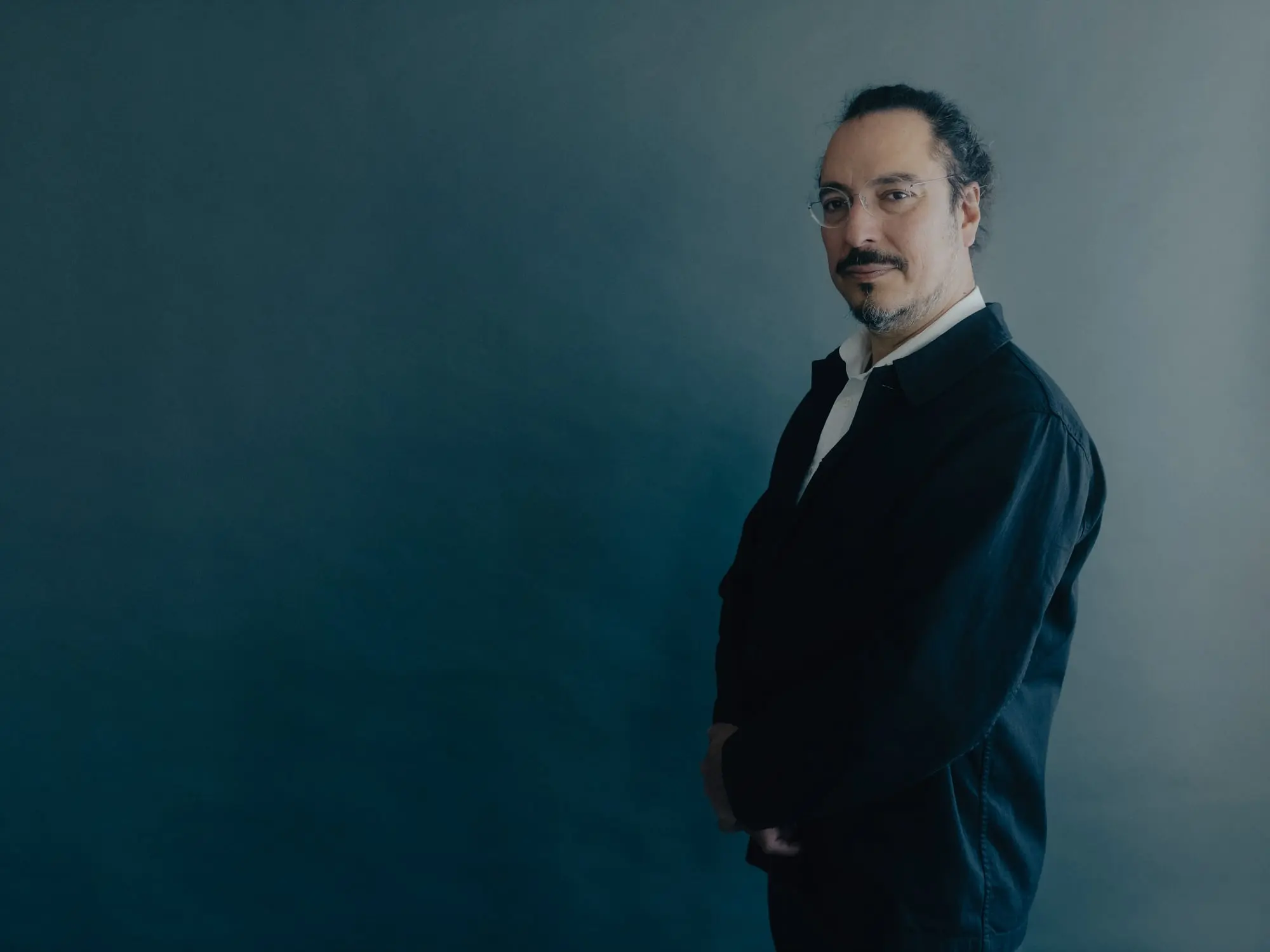 A man in glasses and a suit