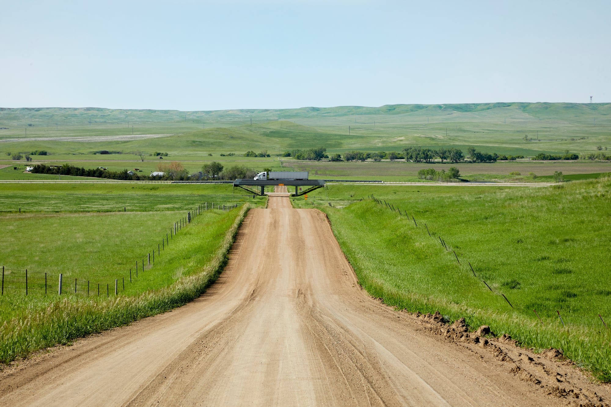 A road through a vast field