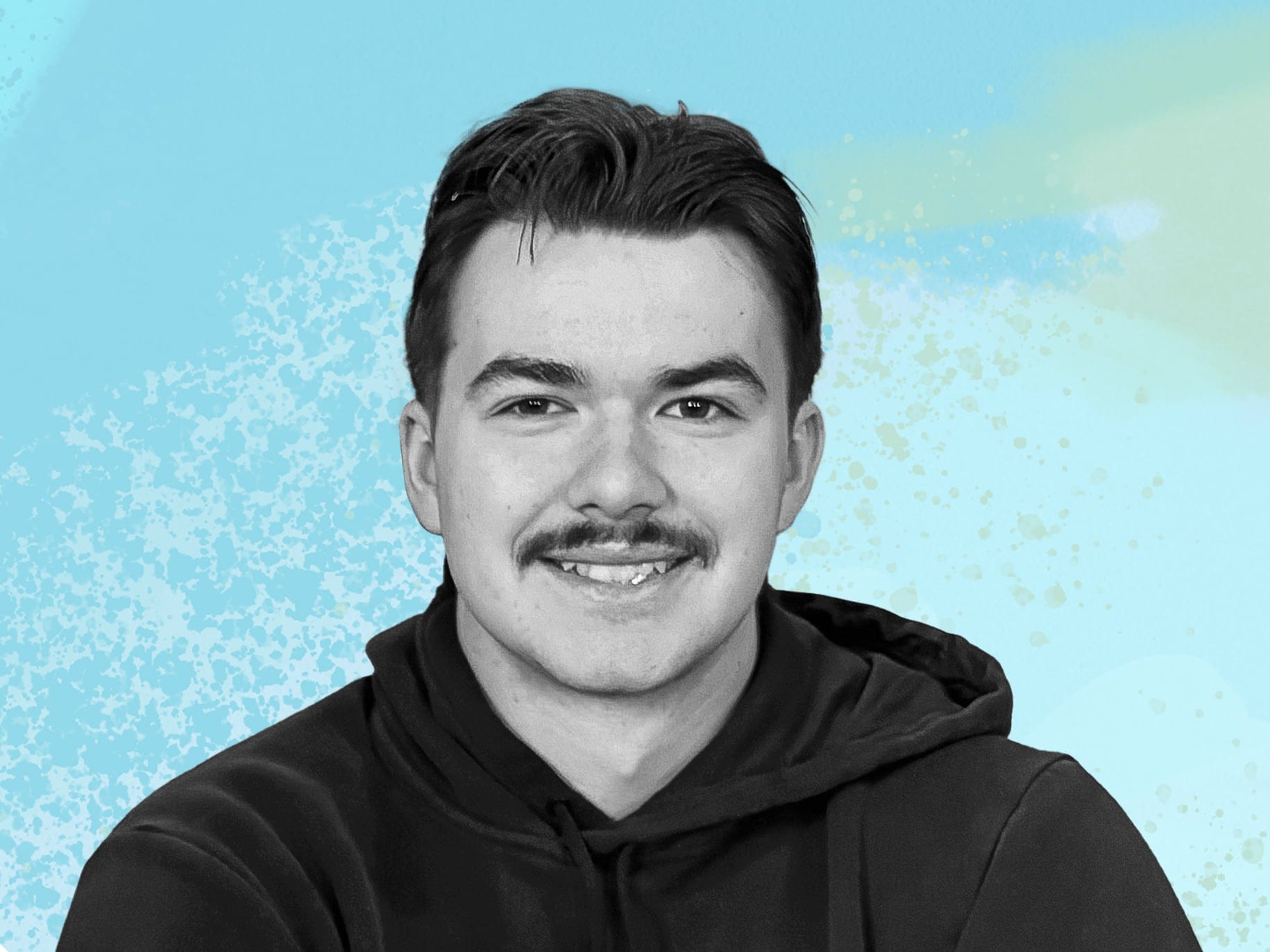 portrait of aidan sampson on blue background