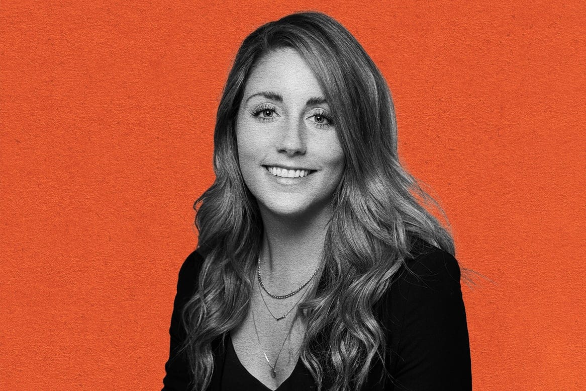 Black-and-white portrait photo of Laurenne Mercier against an orange background
