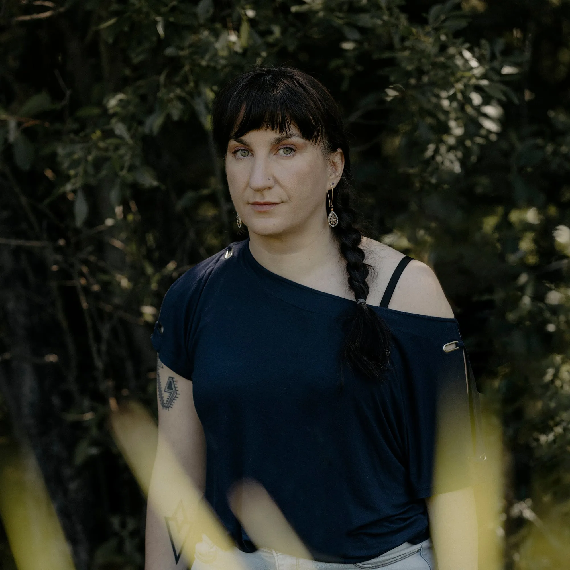 A woman with a ponytail in a black shirt