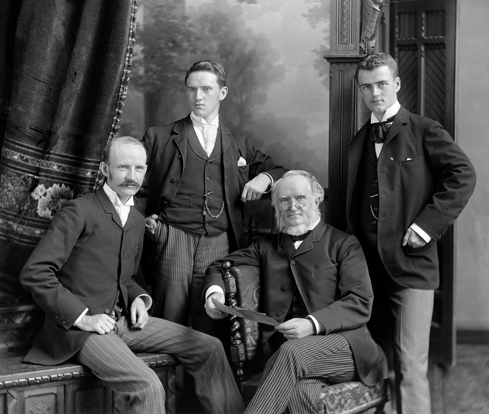 Four men in suits