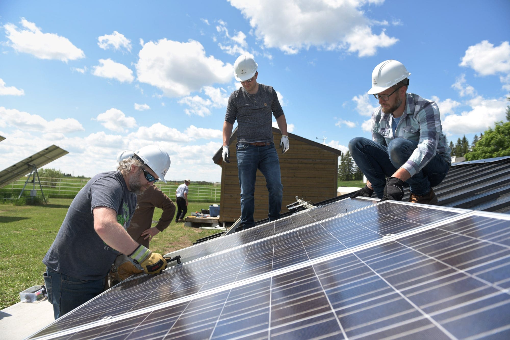 Labour workers installing a solar panel