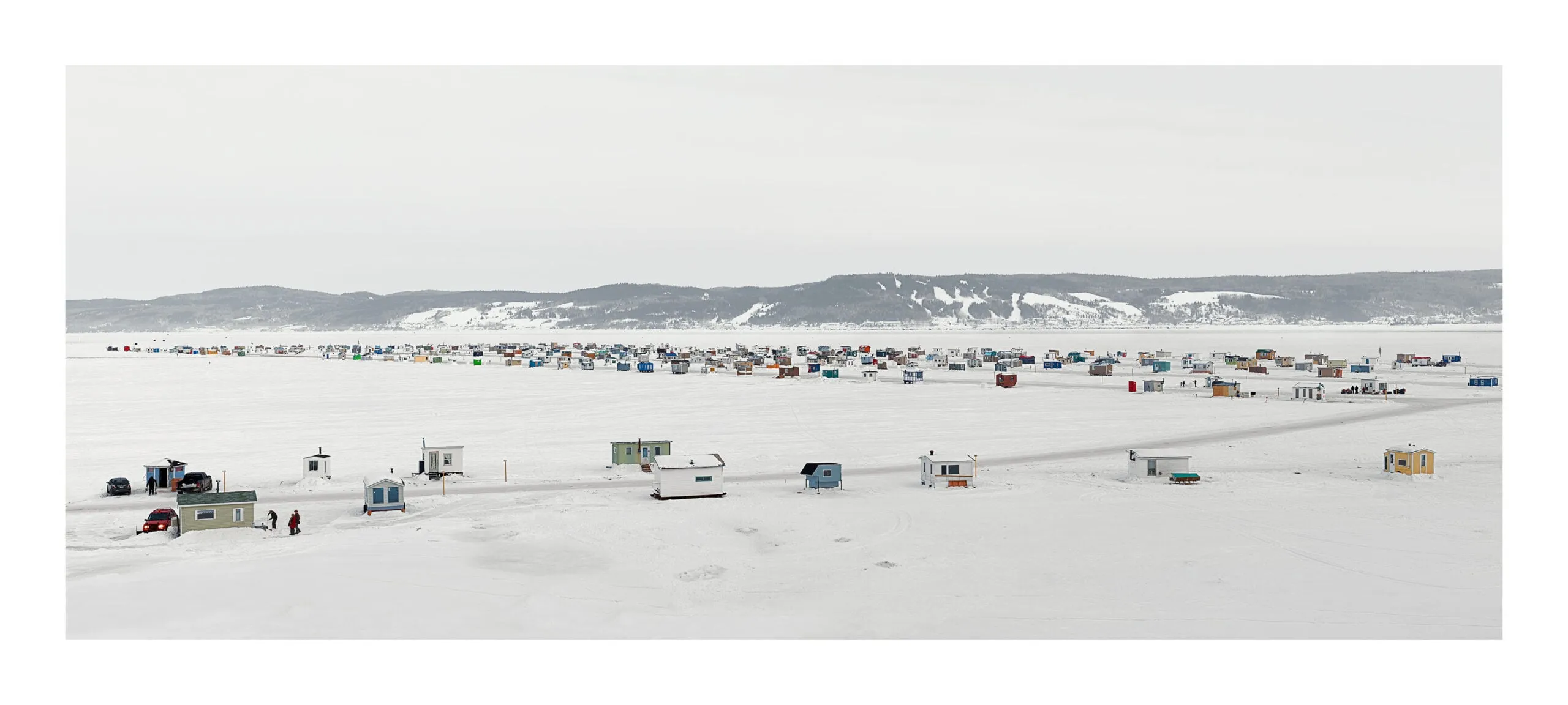 Landscape image of different ice huts