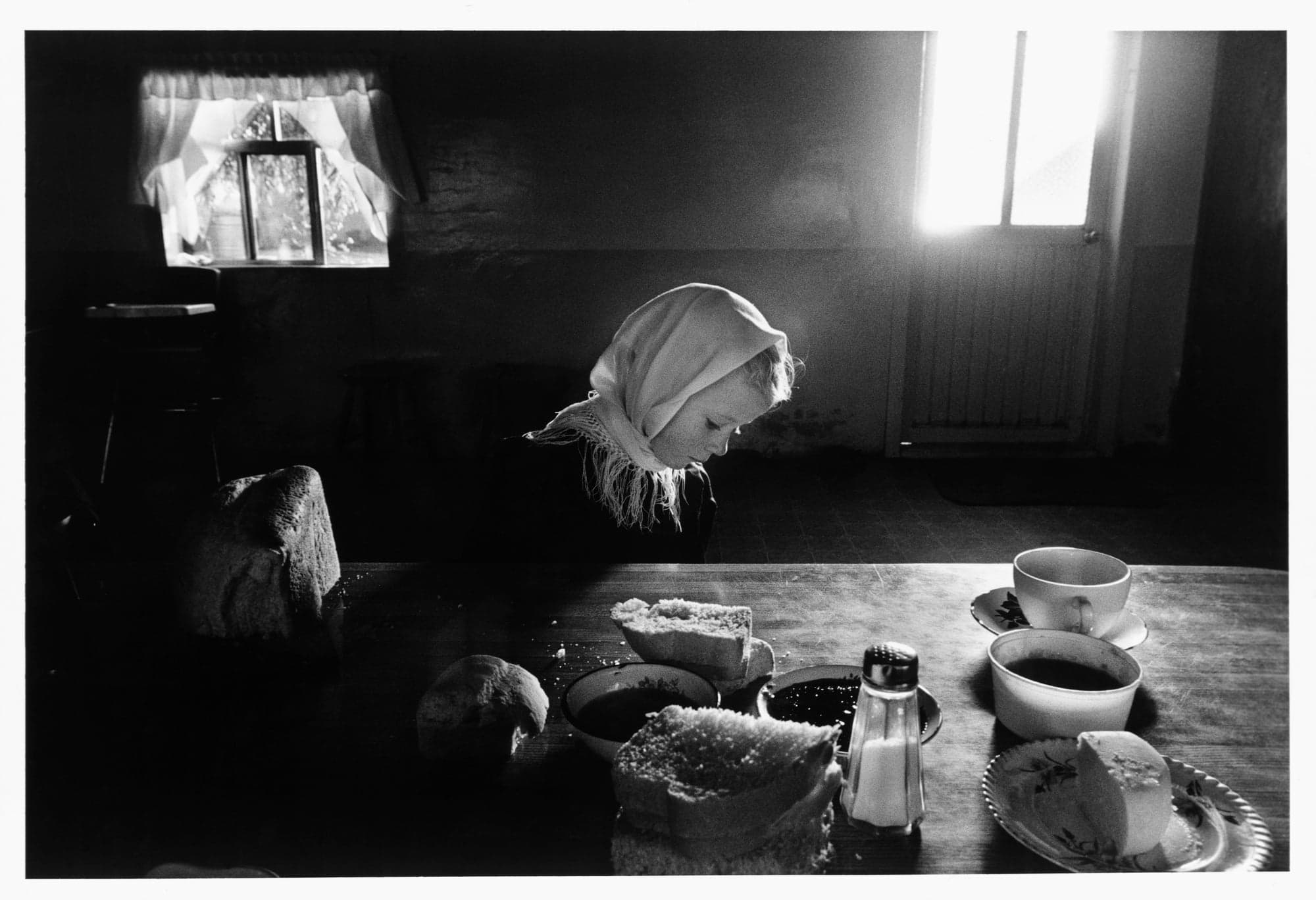 A little girl sitting at a table