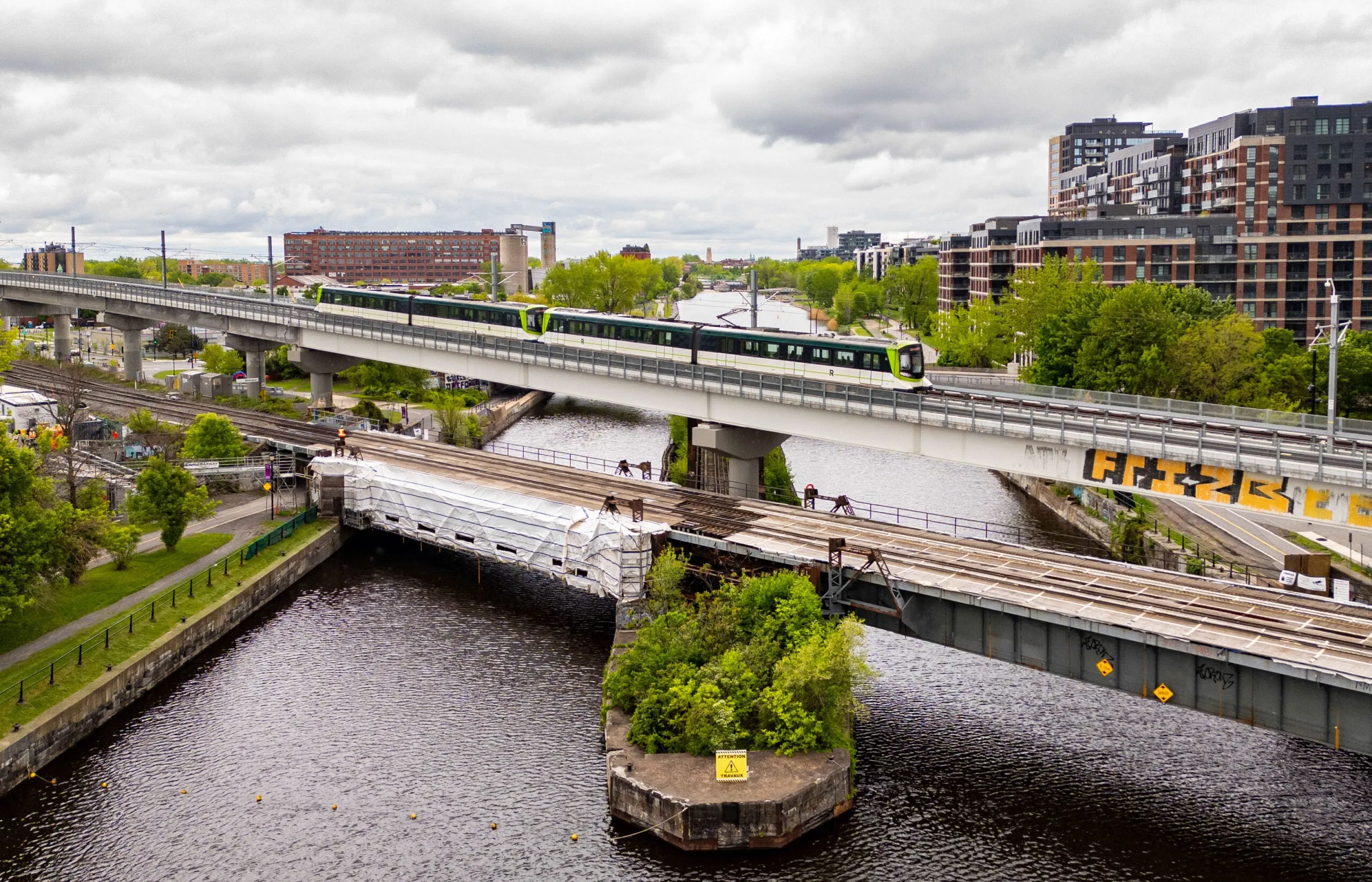 A train on a bridge over a river