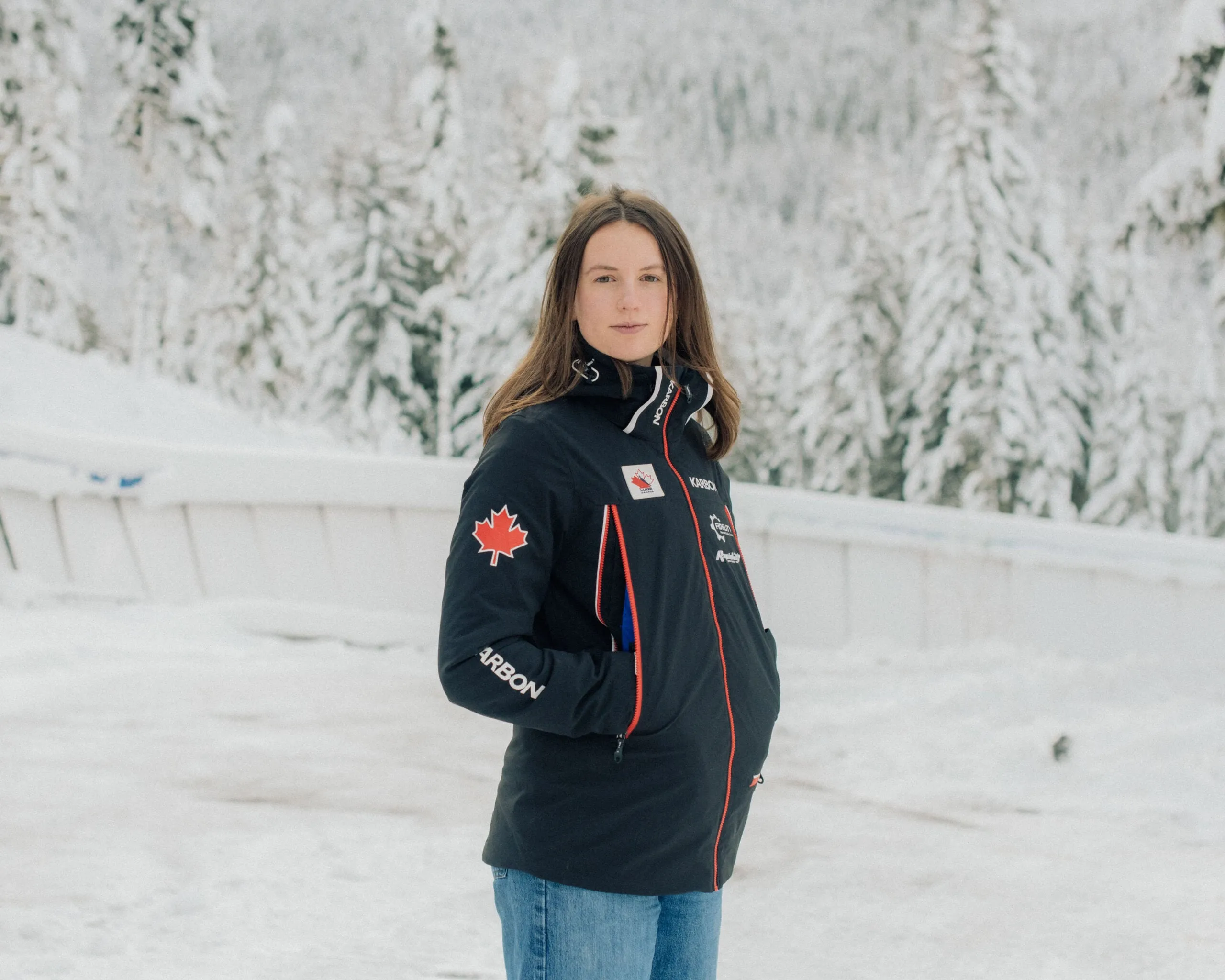 A woman in the snow wearing a black jacket