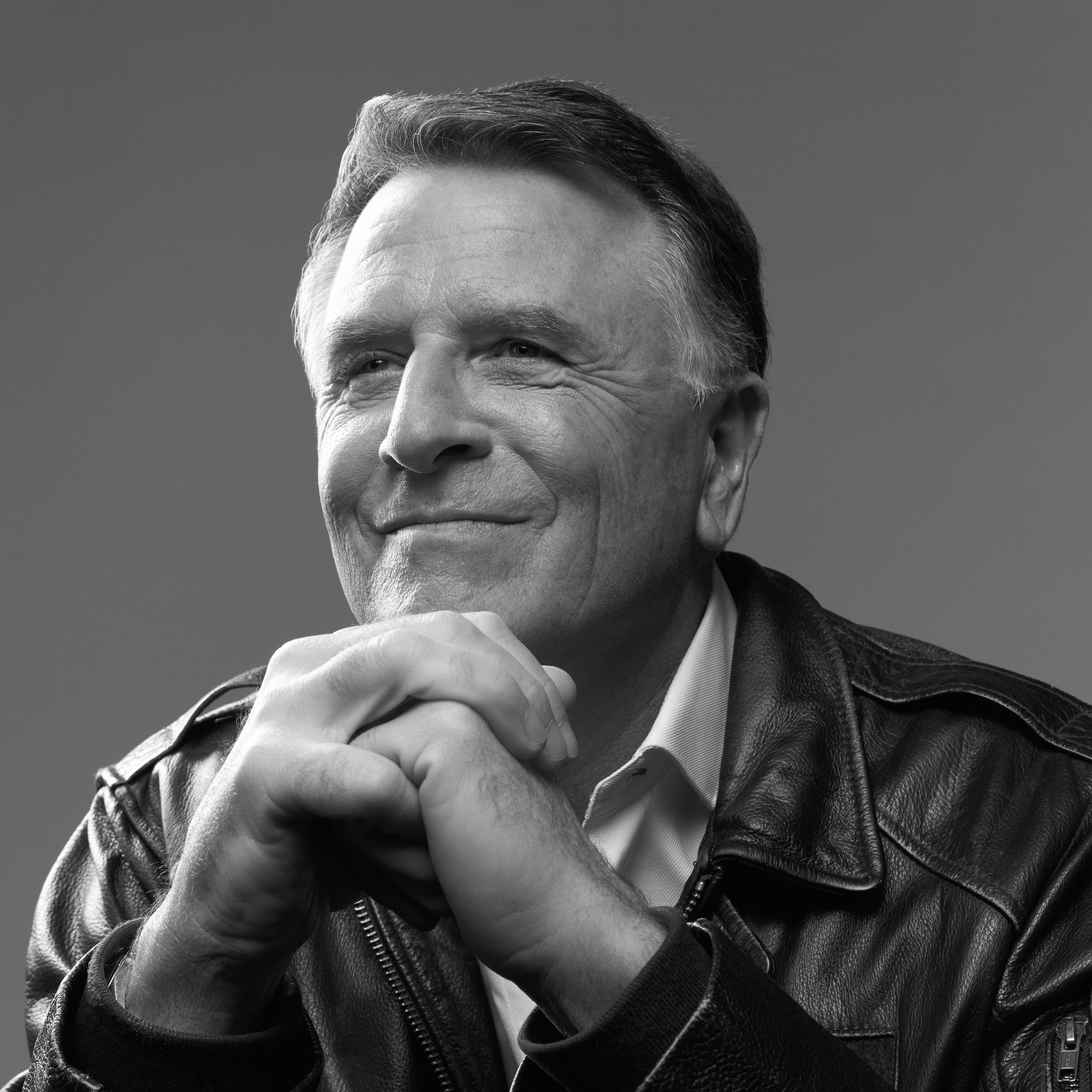 David Chilton looking off to the side of the camera