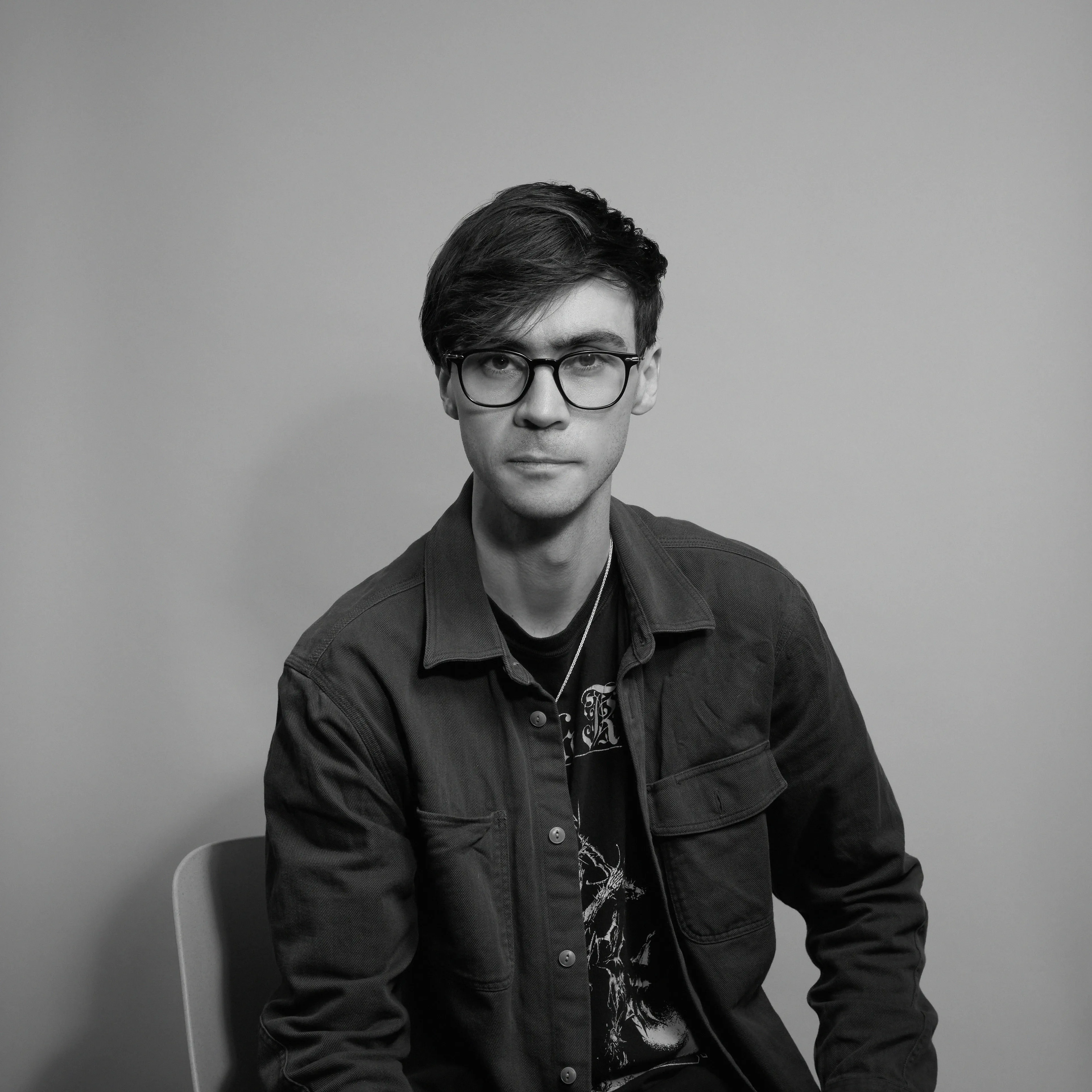 Cohere CEO Nick Frosst looking at the camera, photographed in black and white