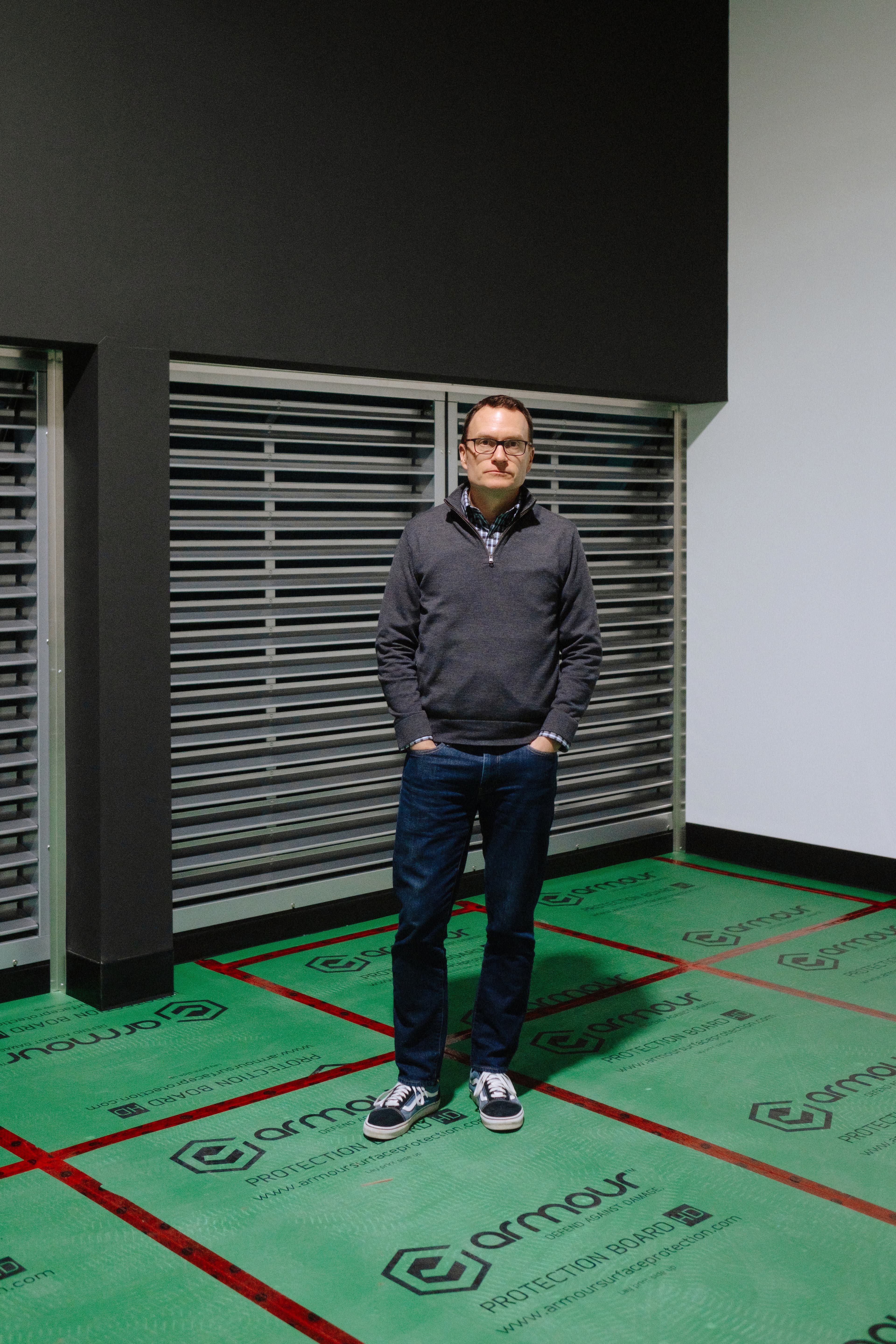 Strahan McCarten standing inside a data centre