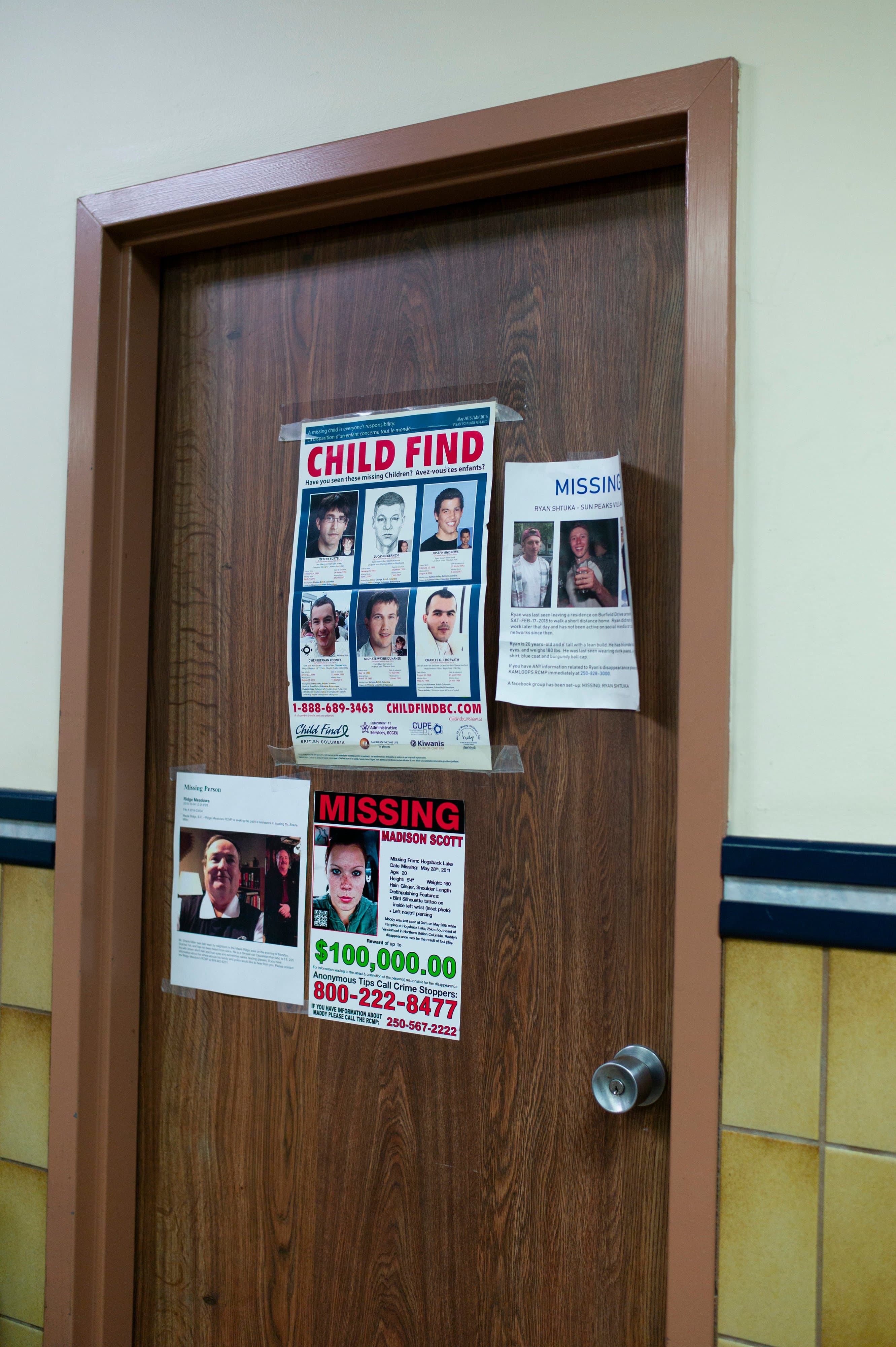 Missing persons posters on a door