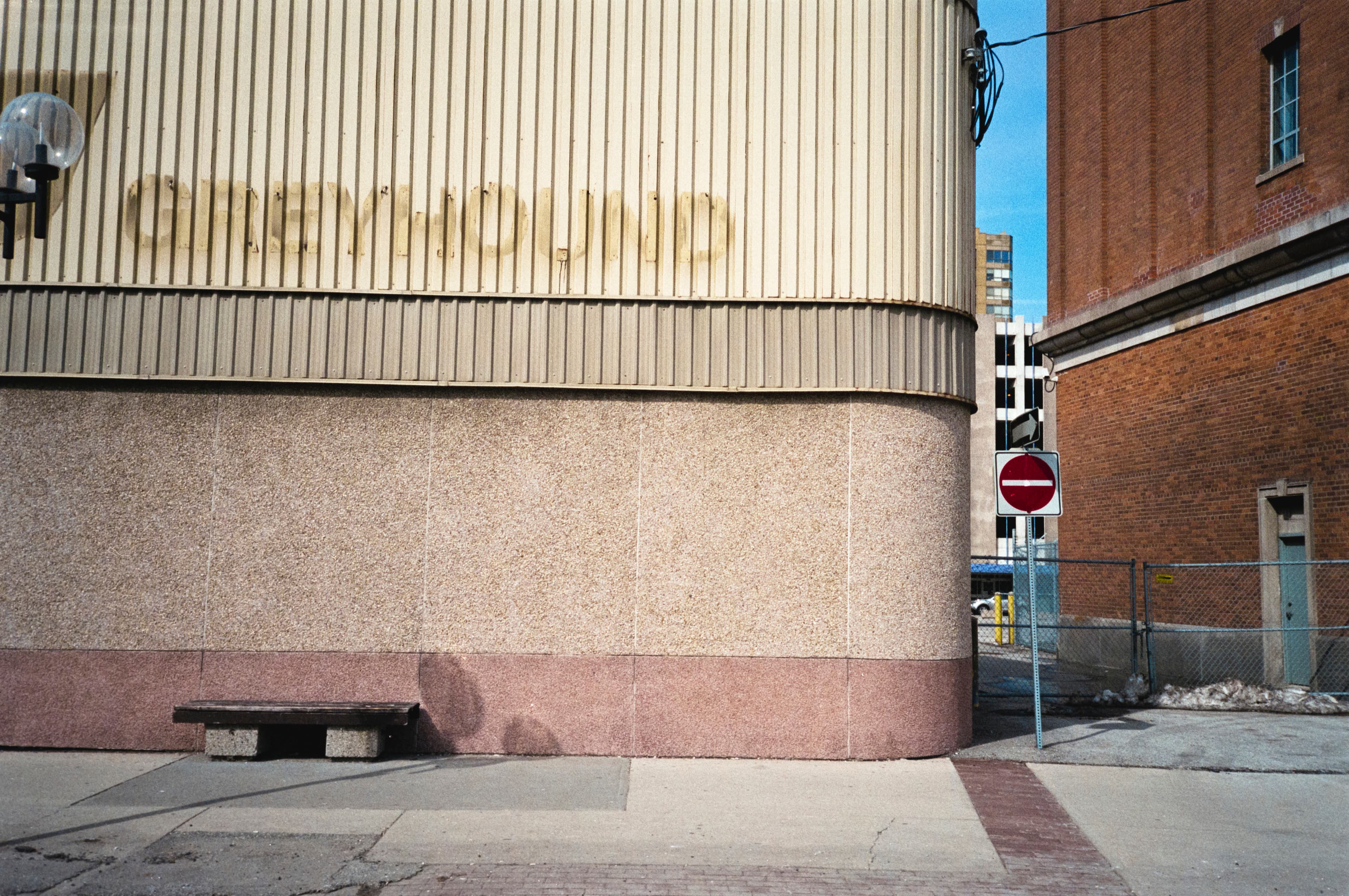 The ghost of the word GREYHOUND on a building