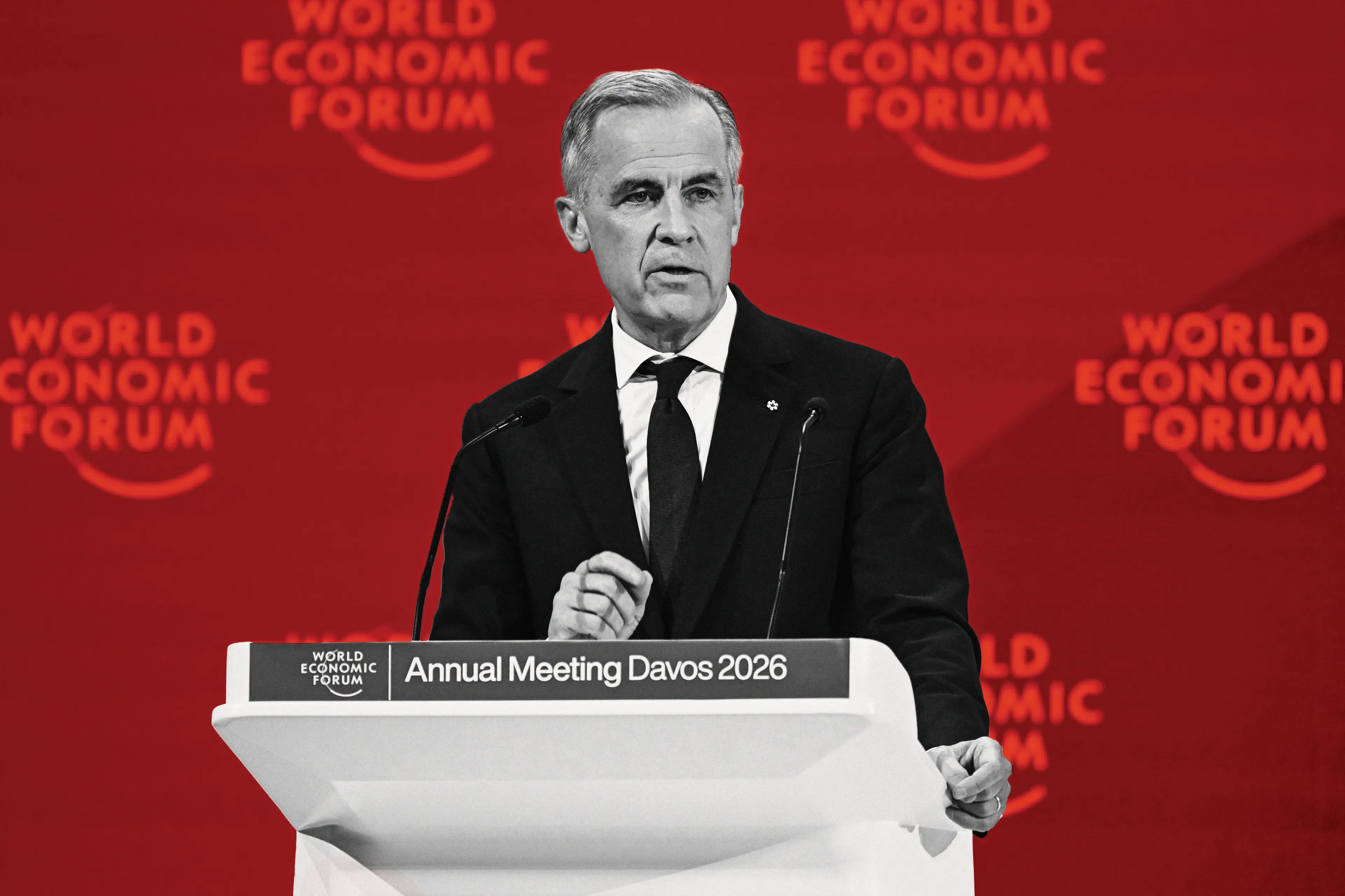 Mark Carney is speaking at the World Economic Forum's Annual Meeting 2026, photographed in black and white. The red background with the logos say "World Economic Forum."