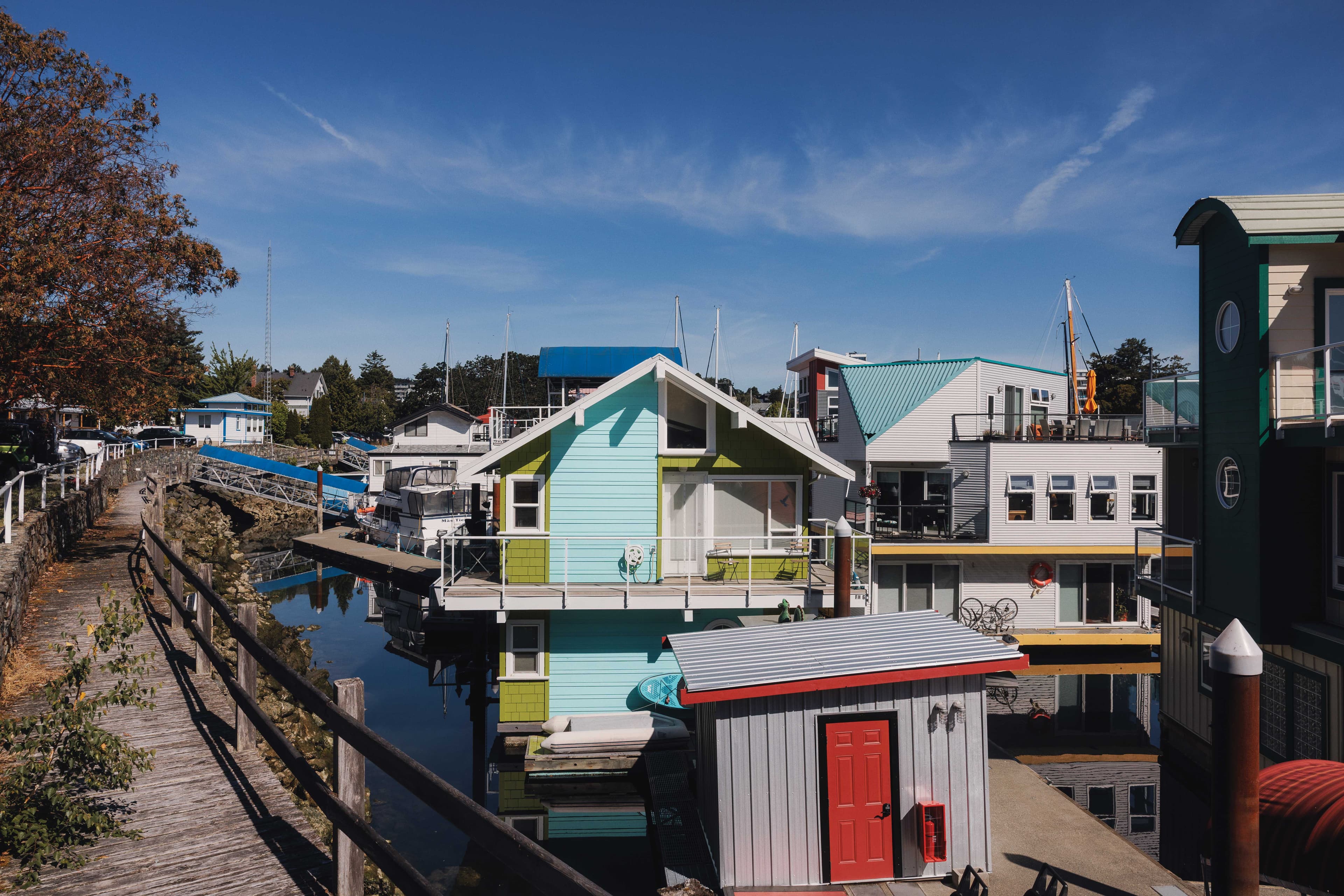 Colourful float-houses under the bright blue sky