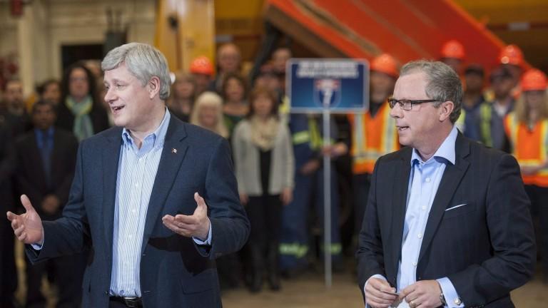 <p>Prime Minister Stephen Harper, left, and Saskatchewan Premier Brad Wall speak during a media event to announce new federal funding for Highway 7 in Saskatoon on Thursday, March 12, 2015. THE CANADIAN PRESS/Liam Richards</p>

