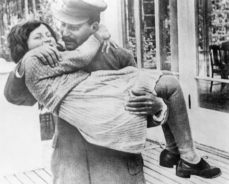 <p>A rare photo of Marshal Josef Stalin holding his daughter, Svetlana. The photo was taken in 1937, at Stalin&#8217;s country house in the suburbs of Moscow. (Bettmann/CORBIS)</p>
