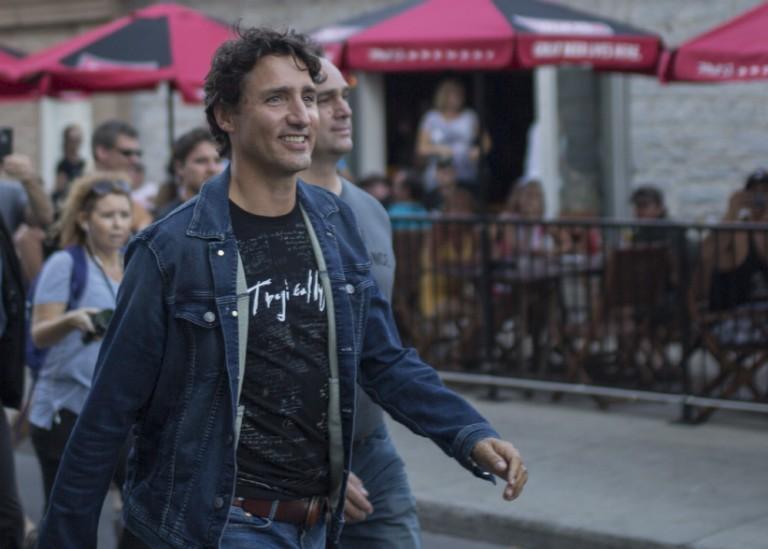 <p>Justin Trudeau meets Tragically Hip fans in downtown Kingston before the final stop on their Man Machine Poem tour. (Photograph by Nick Iwanyshyn)</p>
