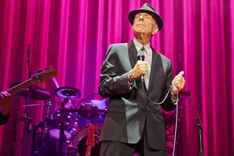 <p>Leonard Cohen performs on stage at Leeds Arena in Leeds, England. (Gary Wolstenholme/Redferns/Getty Images)</p>
