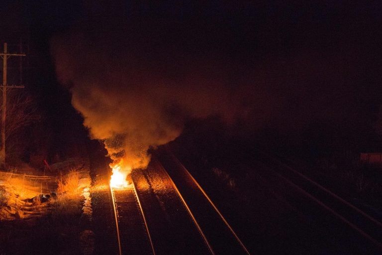 A fire burns on the recently-opened CN tracks in Tyendinaga, near Belleville, Ont., on Monday, Feb. 24, 2020. Earlier Monday police removed a rail blockade in support of Wet'suwet'en Nation hereditary chiefs attempting to halt construction of a natural gas pipeline on their traditional territories in northern B.C. (Lars Hagberg/CP)