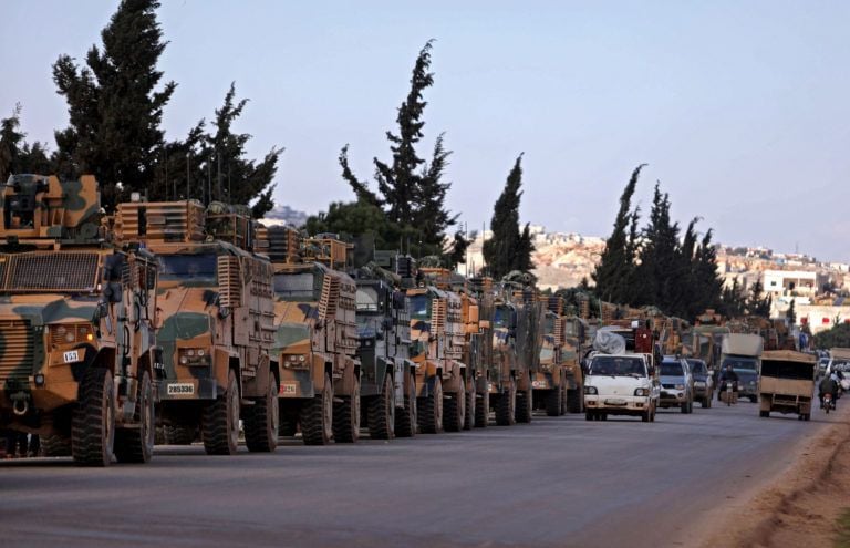 A Turkish military convoy parks near the town of Batabu on the highway linking Idlib to the Syrian border crossing with Turkey, on March 2, 2020 (Aaref Watad/AFP/Getty Images)