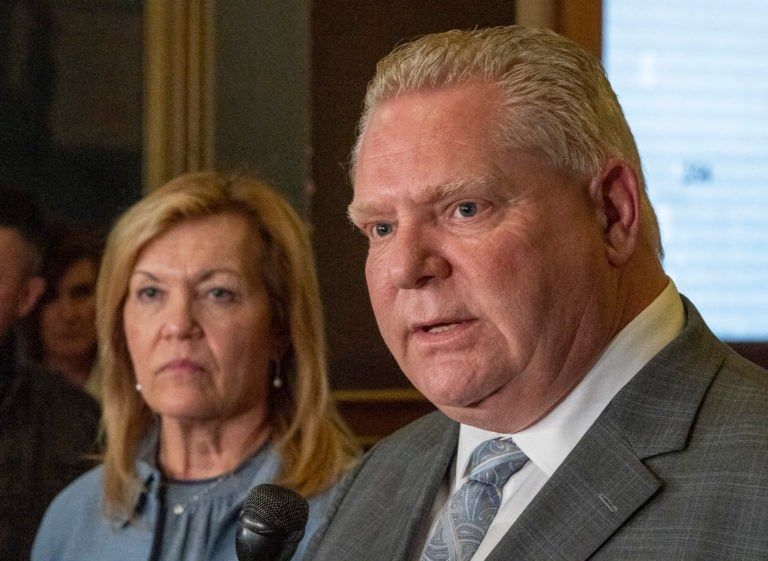 Ontario Premier Doug Ford is flanked by Health Minister Christine Elliott as he answers questions following a meeting of all party leaders and health experts at the Ontario Legislature in Toronto on Mar. 11, 2020. (Frank Gunn/CP)