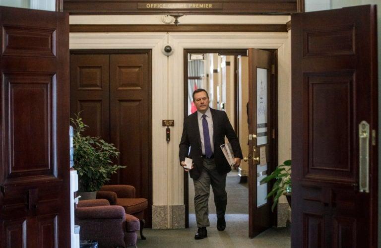 Kenney making his way to the chamber on March 20 as the Alberta legislature passed a series of emergency bills in response to the coronavirus pandemic. (Jason Franson/CP)