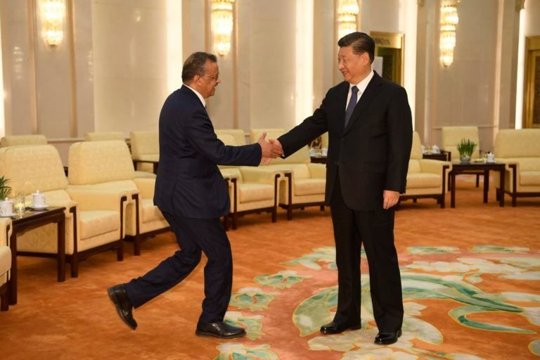 Tedros Adhanom (L), Director General of the World Health Organization, shakes hands with Chinese President Xi Jinping (R) prior to their meeting at the Great Hall of the People in Beijing on Jan. 28, 2020. (CP/EPA/Naohiko Hatta)
