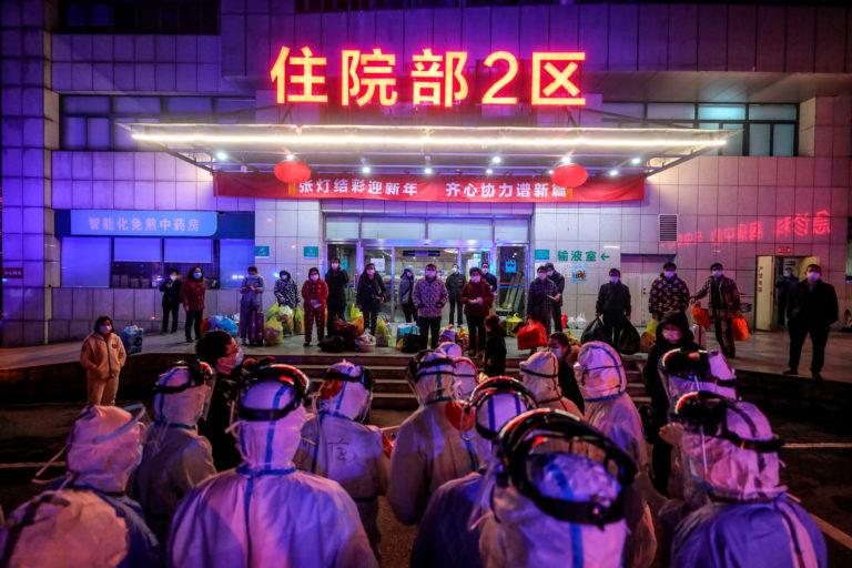 Patients infected with COVID-19 wait to be transferred from Wuhan No. 5 Hospital to the newly-built Leishenshan Hospital in Wuhan, China on March 3, 2020 (AFP/Getty Images)