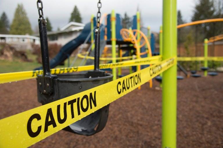 Caution tape is pictured surrounding a children's play structure in North Vancouver, B.C. Monday, March 23, 2020. THE CANADIAN PRESS/Jonathan Hayward