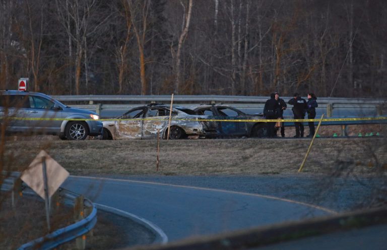 Officers at the scene of the crash between Stevenson’s car and Wortman’s fake RCMP vehicle (John Morris/Reuters)