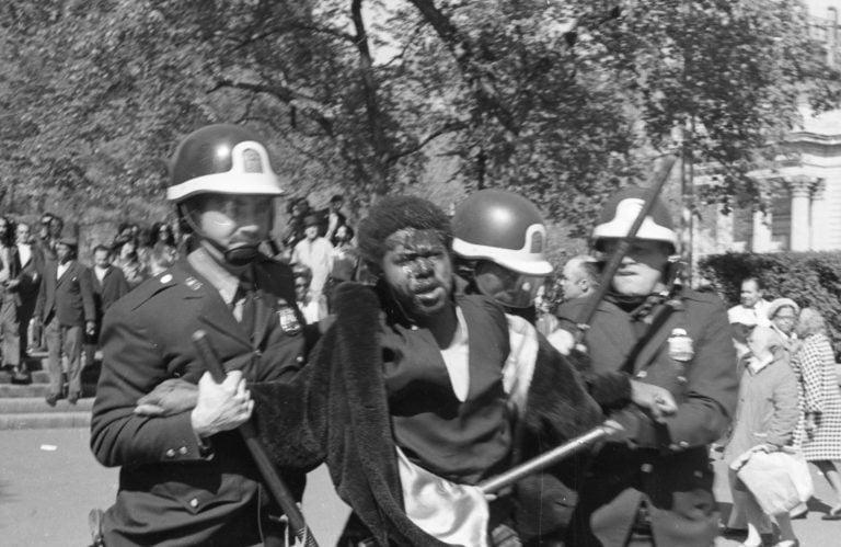 Police arrest an African-American protester, whose face is bloodied following a confrontation with police, during an anti-Vietnam War protest near 14th street in Manhattan, New York City, New York following the Kent State shooting, May 7, 1970. (Stuart Lutz/Gado/Getty)
