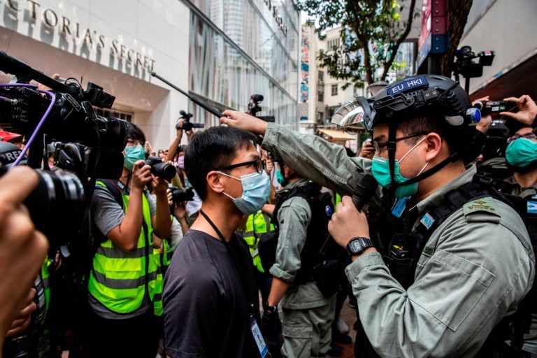 Police guard an MTR station exit near the Legislative Council in Hong Kong on May 27, 2020 (Isaac lawrence/AFP/Getty Images)