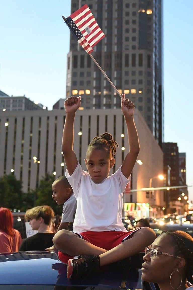 Protests across the U.S. began in May and continued into June: a young girl in St. Louis on May 29 (Michael B. Thomas/Getty Images)