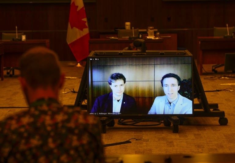 Marc Kielburger (left) and Craig Kielburger (right) appear as witnesses via videoconference during a House finance committee meeting on July 28, 2020 (CP/Sean Kilpatrick)