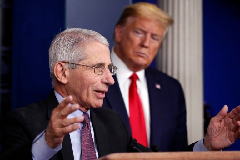 Donald Trump watches as Dr. Anthony Fauci, director of the National Institute of Allergy and Infectious Diseases, speaks about the coronavirus in Washington on Apr. 22, 2020. (CP/AP/Alex Brandon)