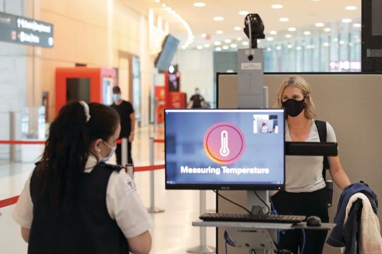 Passengers are temperature screened at the departure gates at Pearson International Airport. Toronto will move into phase three of reopening with other parts of Ontario later in the week as the province tries to slow the spread of COVID-19 in Toronto. July 30, 2020. (Steve Russell/Toronto Star/Getty Images)