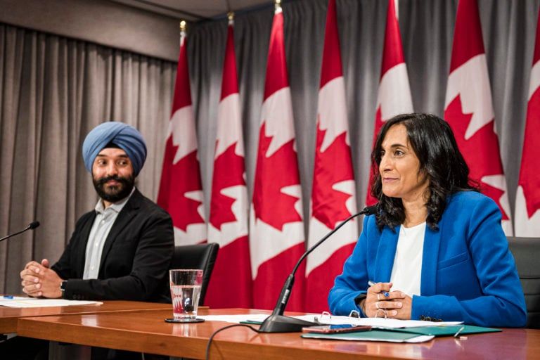 Navdeep Bains, Minister of Innovation, Science and Industry and Anita Anand, Minister of Public Services and Procurement, make an announcement about vaccine procurement, in Toronto, on Aug., 5, 2020 (CP/Christopher Katsarov)