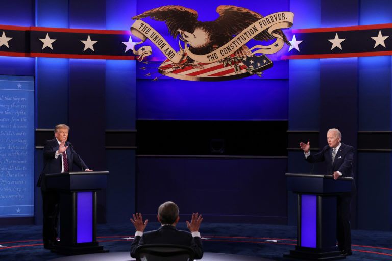 U.S. President Donald Trump and Democratic presidential nominee Joe Biden participate in the first presidential debate moderated by Fox News anchor Chris Wallace (C) at the Health Education Campus of Case Western Reserve University on September 29, 2020 in Cleveland, Ohio. This is the first of three planned debates between the two candidates in the lead up to the election on November 3. (Scott Olson/Getty Images)