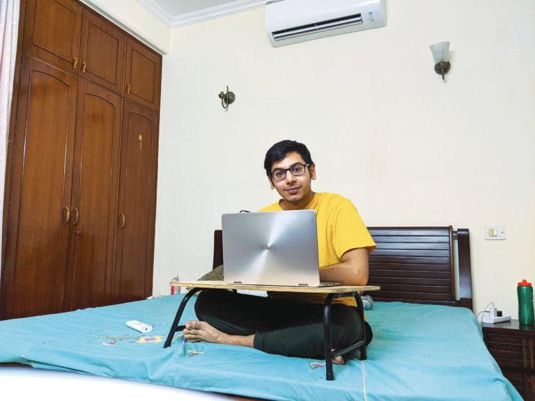Malik, shown here at home in New Delhi, studies UBC’s engineering courses online (Photograph by Ebti Nabag)
