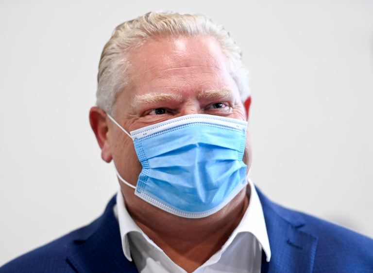 Ontario Premier Doug Ford tours a warehouse where they ship personal protective equipment during the COVID-19 pandemic in Milton, Ont., on Wednesday, September 30, 2020. THE CANADIAN PRESS/Nathan Denette