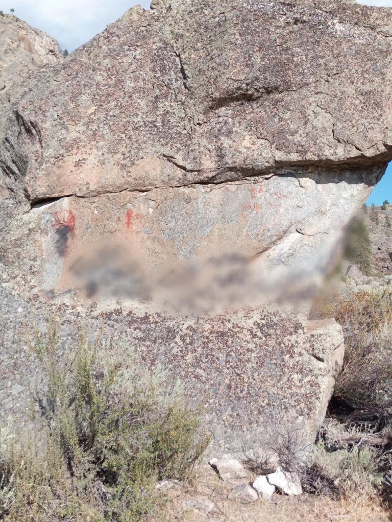 The pictographs at Osoyoos Lake were vandalized with racist slurs (which we have obscured) (Courtesy of Nathan McGinnis)