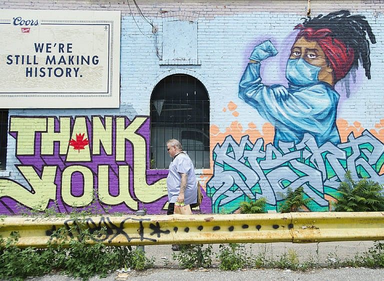 A mural pays tribute to health-care workers during the COVID-19 pandemic in Toronto on July 22, 2020 (CP/Nathan Denette)