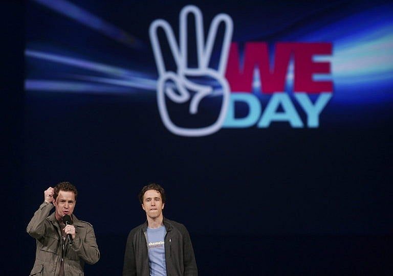 Marc and Craig Kielburger speak at the WE Day celebrations in Kitchener, Ont., on Feb. 17, 2011 (CP/Geoff Robins)