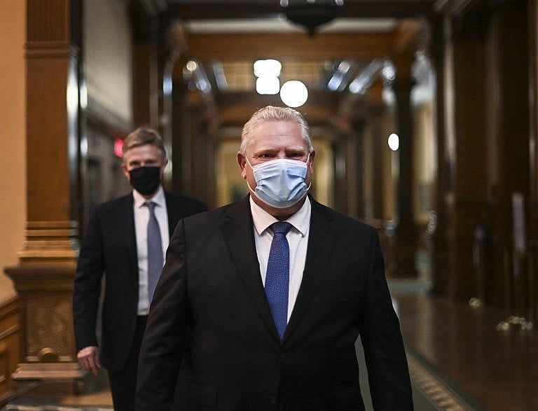 Ontario Premier Doug Ford Ontario walks to his press conference during the COVID-19 pandemic in Toronto, Friday, November 20, 2020. Ontario is moving the COVID-19 hot spots of Toronto and Peel Region into lockdown starting Monday. THE CANADIAN PRESS/Nathan Denette