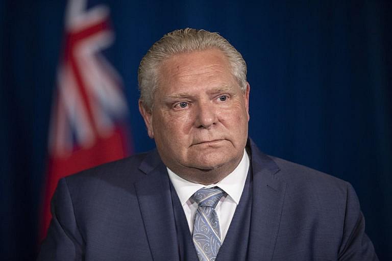 Ontario Premier Doug Ford attends a briefing, as the Provincial Government announce a series of measures to combat the spread of COVID-19, In Toronto, Friday, Nov, 13, 2020. THE CANADIAN PRESS/Chris Young