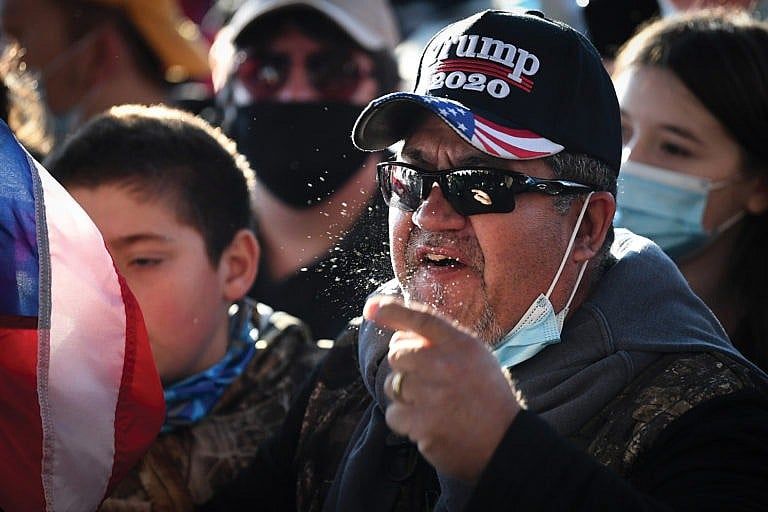 A Trump supporter yells at counter-protesters outside of the U.S. Supreme Court during the Million MAGA March in Washington on Saturday, Nov. 14, 2020. (Caroline Brehman/CQ-Roll Call/Getty Images)
