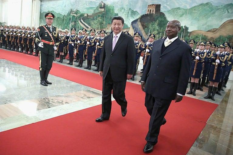 Uganda’s Museveni (right), with China’s Xi Jinping in 2015, has been in power for 34 years (Feng Li/Getty Images)