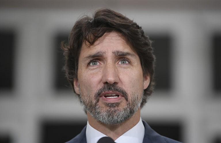 Trudeau responds to a question about China during a news conference outside Rideau Cottage in Ottawa on June 25, 2020 (CP/Adrian Wyld)
