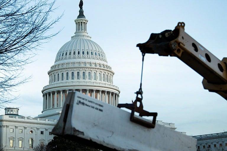 A crowd control fence around Capitol Hill is reenforced with concrete barriers on Jan. 7, 2021, in Washington, DC (BRENDAN SMIALOWSKI/AFP via Getty Images)