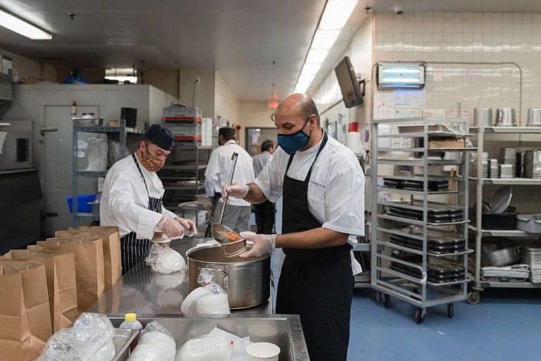 Bhargava and his kitchen staff prepare meals for guests quarantining at an isolation centre (Photograph by Lucy Lu)